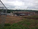 The size of the building is really apparent now as final section of steel at the rear has been installed.  This is our view of the site when we are outside doing PE.